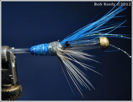 The front of the fly is completed with the feelers, eyes and forward hackle.